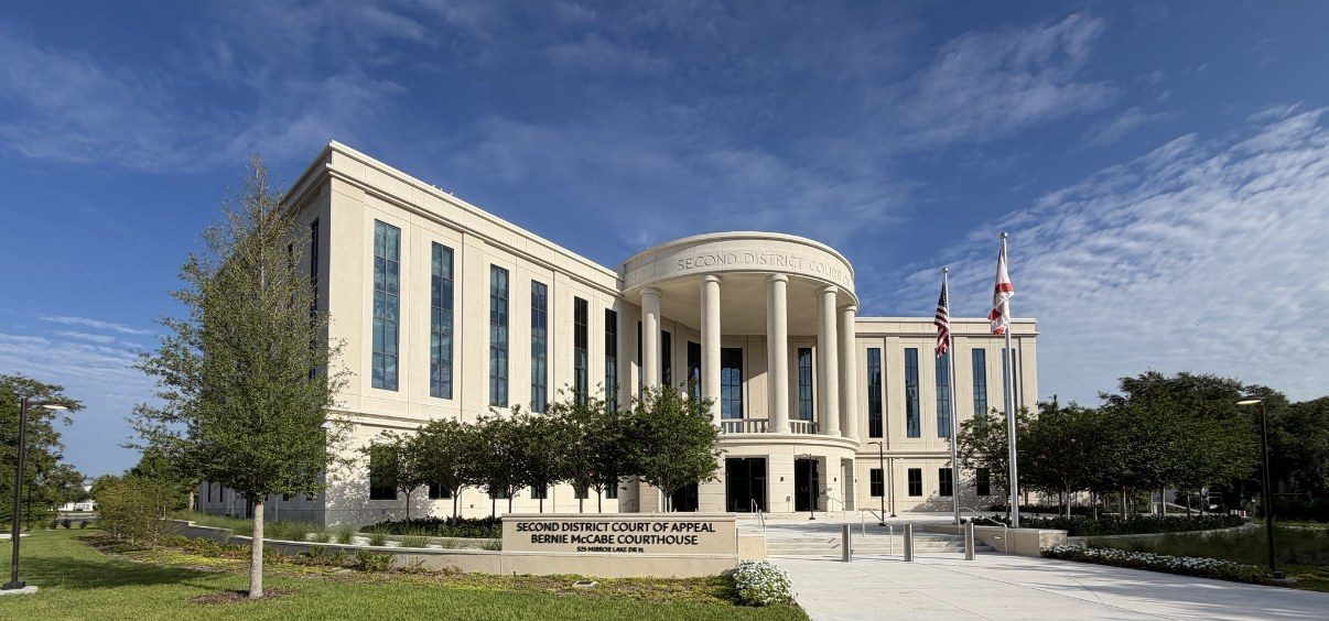 Second District Court of Appeal courthouse with American and Florida flags
